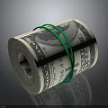 Rolled US Dollar Bills Secured With Green Rubber Bands On Dark Background