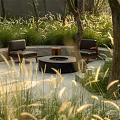 Cozy Outdoor Sofa Seating Area With Fire Pit Surrounded By Trees And Tall Grass