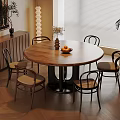 Modern Dining Area with Round Wooden Table Chairs Fruits Vase Lamp and Cabinet