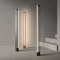 Modern Slim Floor Lamp With Metallic Design And Warm Lighting In Minimalist Interior