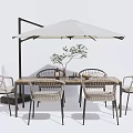 Outdoor Garden Wooden Table And Rattan Chairs Set With White Umbrella And Small Plant