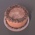 Delicious Chocolate Cake With Spiral Cream Decoration And Chopped Chocolate Sprinkles On Round Tray