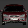 Red Sedan Car With Dusty Exterior Parked On Shiny Reflective Surface