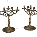 Two Vintage Brass Candelabra With Multiple Arms And Ornate Base Design