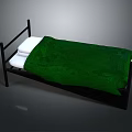 Simple Black Frame Bed With Green Blanket And White Pillows