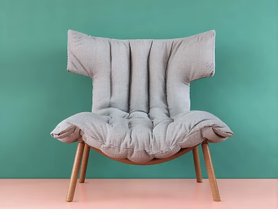 Comfortable Gray Lounge Chair With Pleated Padding And Wooden Legs Against Green Wall 3d model