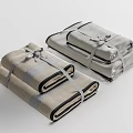 Soft Linen Folded Towels In Beige And Gray Stacked With Ribbon Ties