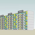 Modern Residential Apartment Building With Yellow And Gray Exterior Multiple Windows And Balconies