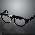 Fashionable Vintage Sunglasses With Black Frame Gold Accents And Tinted Lenses