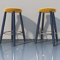 Modern Bar Stools With Yellow Cushioned Seats Navy Blue Legs And Metal Ring Footrest