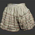 White Layered Ruffled Skirt With Red And Green Striped Trim Design