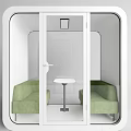 Green Public Chairs in White Square Enclosure with Glass Doors and Small Table Indoor