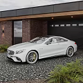 White Luxury Sports Car Parked In Front Of House With Garage And Red Brick Wall