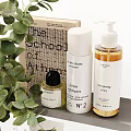 Daily Skincare And Bath Essentials On Organized Shelf With Eucalyptus Plant And Pampas Grass