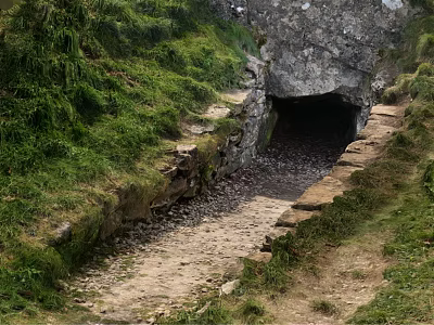 Stone Tunnel Entrance Surrounded by Lush Green Vegetation and Dirt Path 3d model