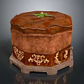 Brown Decorative Storage Box With Intricate Gold Patterns And Green Leaf Decoration On Top