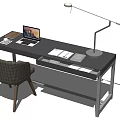 Modern Black Desk With Open Laptop Books Desk Lamp And Chair