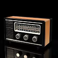 Classic Vintage Radio With Black And Wooden Casing Knobs And FM Dial