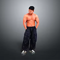 A Shirtless Muscular Man In Dark Cargo Pants And Black White Sneakers Against Grey Background
