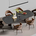 Elegant Black Marble Dining Table Set With Brown Chairs Green Plant Candles And Fruit Platter