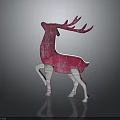 Red and white decorative textured deer figurine on gray background with reflection