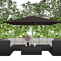 Outdoor Rattan Sectional Sofa With Brown Umbrella And Green Garden Plants
