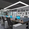 Modern Public Office Space With Workstations Computer Monitors Office Chairs Framed Artworks And Ceiling Lights