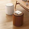 Modern Pleated White And Brown Stools With A Book On Wooden Floor