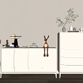 Light Colored Entryway Cabinet And Sideboard With Deer Figurine Table Lamp And Potted Plant