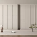 Modern White Wardrobe In Bedroom Interior With Small Doll Magazine And Plant