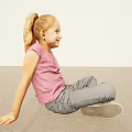 Smiling Woman Sitting On Floor Wearing Pink Top Gray Pants And Black Shoes