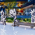 Neon Style Cartoon Character Sculptures Photo Spot With Various Poses Modern Building And Green Plants