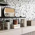 Decorative Ornament Set on Black Shelves with Vintage Radio Books Plant Jars and Speckled Wall
