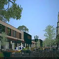Night View Of Commercial Street With Outdoor Seating Trees And Lighting