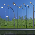 Outdoor Street Lights Illuminated At Night With Trees Grass And Reflections On Ground