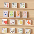 Tea Product Packaging Decorative Set with Fruit Themed Colorful Boxes and Bags on Wooden Shelf