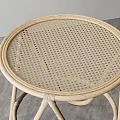 Round Rattan Coffee Table With Crossed Legs And Minimalist Natural Design
