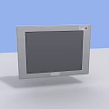 Computer Monitor with Silver Frame and Black Screen on White Desk Light Blue Background
