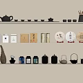 Traditional Tea Accessories Display On Shelves With Teapots Cups And Tea Cakes