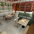 Modern Restaurant Interior With Green Walls Red Curved Ceiling And Transparent Spherical Pendant Lights