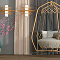 Golden Frame Hanging Chair With Gray Cushion Throw Pillows Green Vase And Pink Blossom Branches