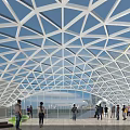 Modern Geometric Glass Roof Interior With People In Public Architectural Space