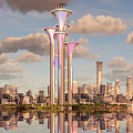 Illuminated Landscape Sculpture With Three Towers Olympic Rings And City Water Reflection