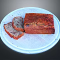 Freshly Baked Banana Bread with Slices on White Ceramic Plate