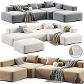 Modern Sectional Sofa Set With Grey White Upholstery Pillows Blankets And Ottoman