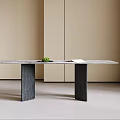 Dining Table With Modern Minimalist Design Marble Top Black Column Legs Green Plant And Book