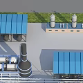 Industrial Plant With Blue Roof Buildings Storage Tanks Pipes Chimneys And Grass Area