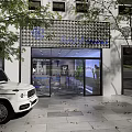 Modern Milk Tea Shop Exterior With Glass Doors And Lit Sign