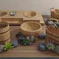 Wooden Bathtubs With Water And Rose Petals Surrounded By Stones And Green Plants