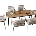 Elegant Outdoor Table with Six Rattan Chairs and Fresh Fruit on Tabletop